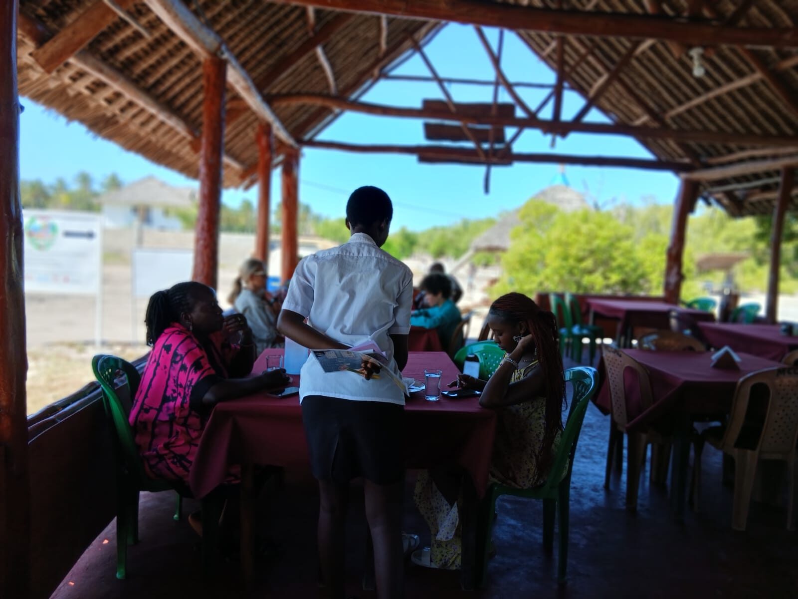 Guests enjoying a meal at Mangrove Breeze Restaurant