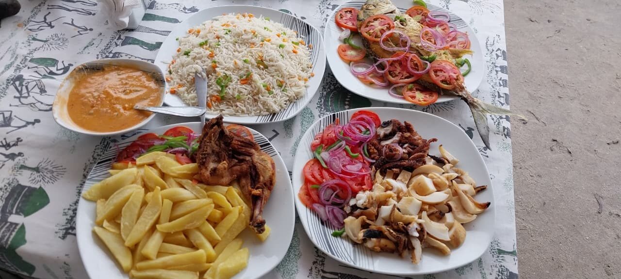 Fresh grilled fish, rice and seafood platter